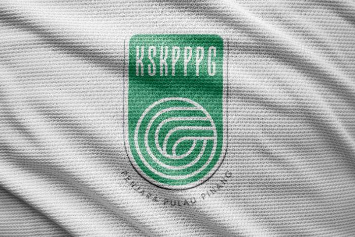 Green KSKPPPG club logo printed on white fabric